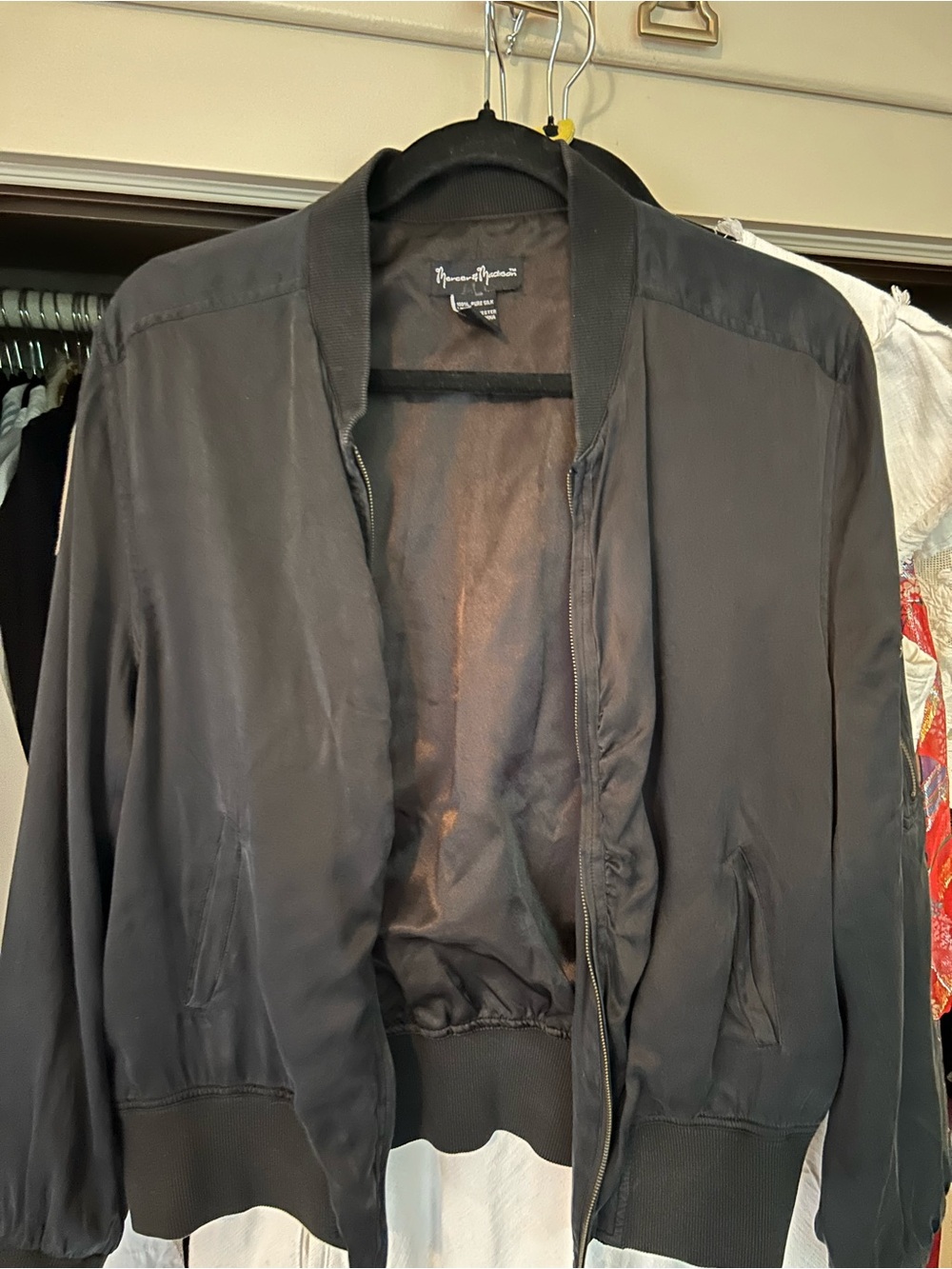 Black silk bomber jacket by Mercer & Madison
L
